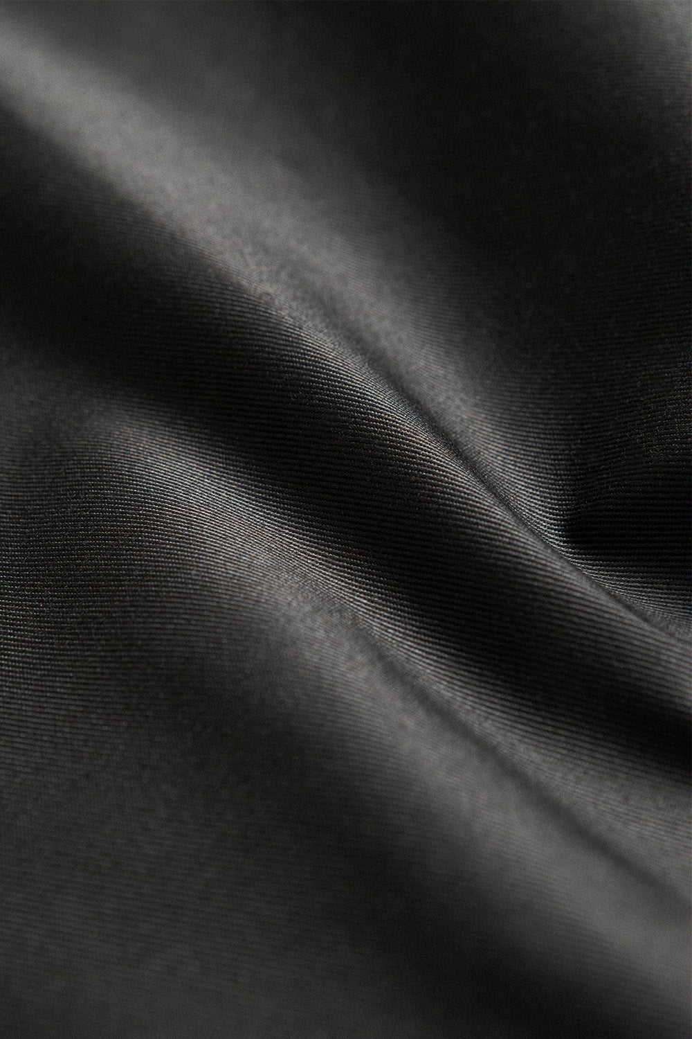 Poly cotton blend fabric in true black - a durable and versatile choice for sewing kits and crafting