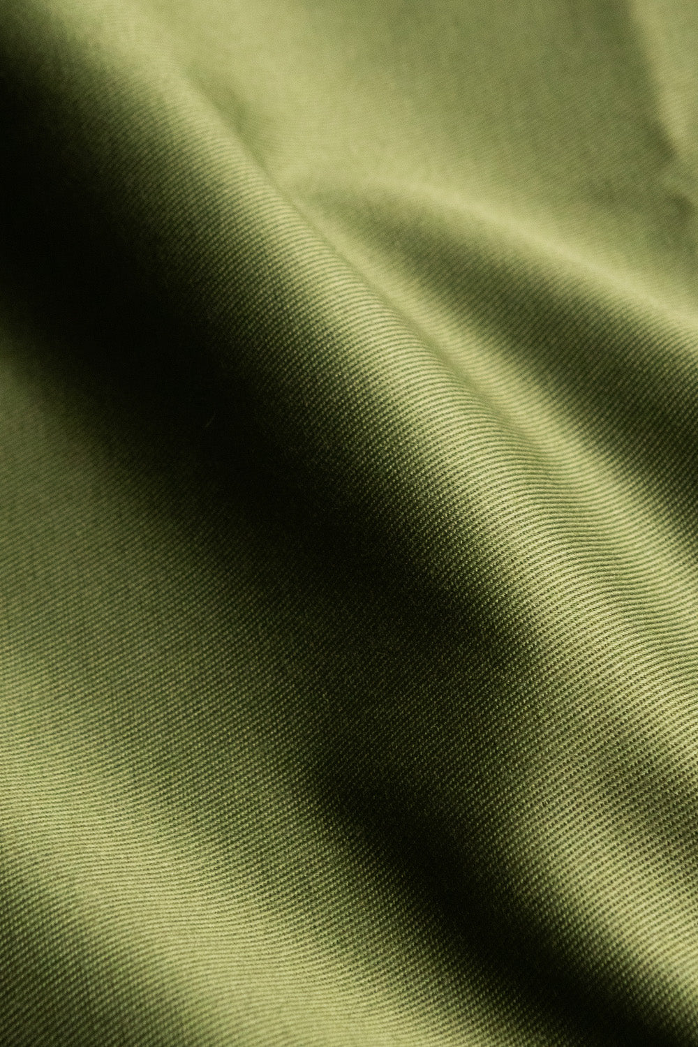 Poly cotton blend fabric in fern green color - a durable and versatile choice for sewing kits and crafting